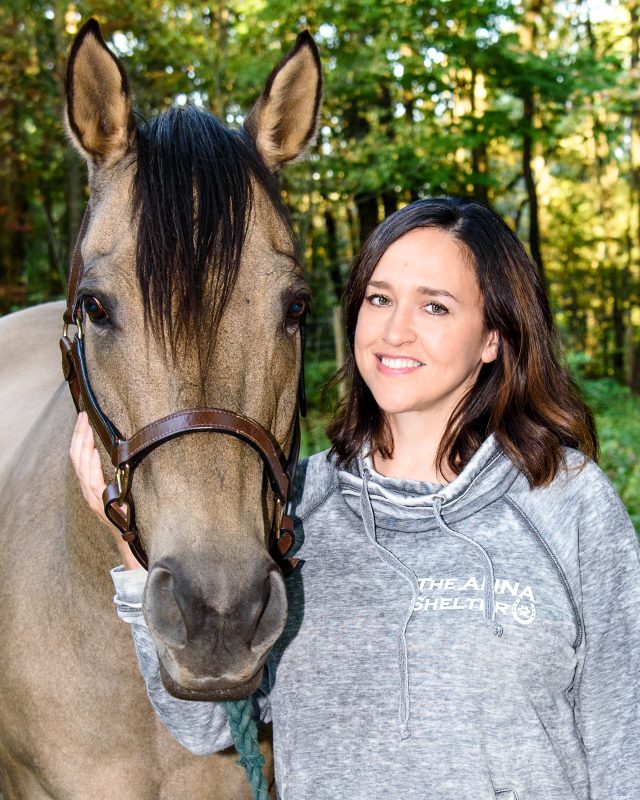 Ruth and a horse named Seger are taking a photo together