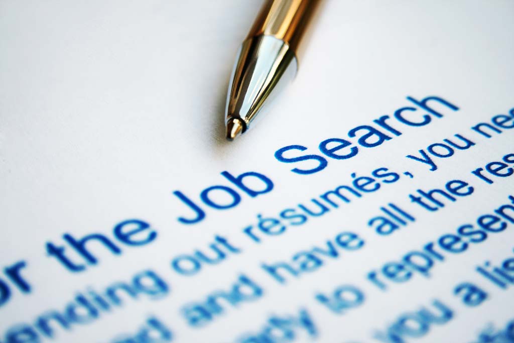 Job search paper with pen