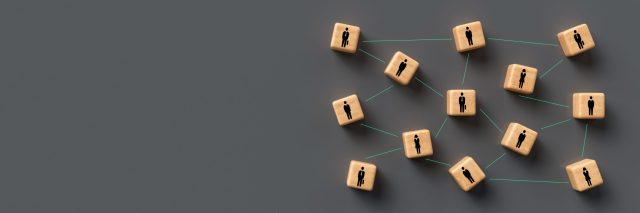 Wooden bloack with black animated business people