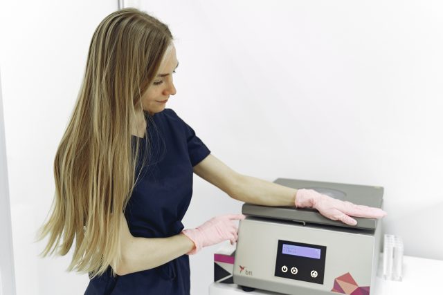 A female medical billing and coder is going through files